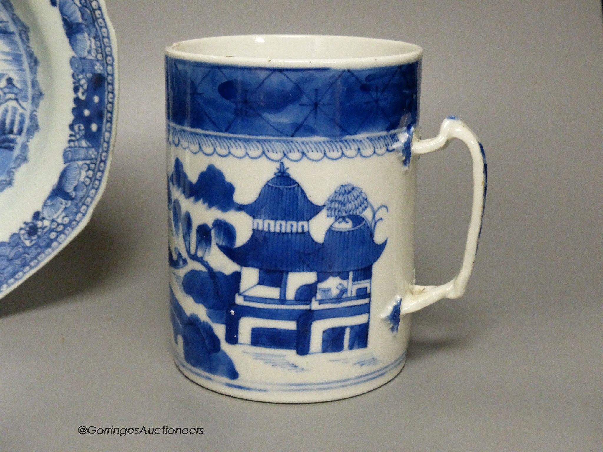 An 18th century Chinese blue and white mug, plate and saucer, largest 23cm diameter